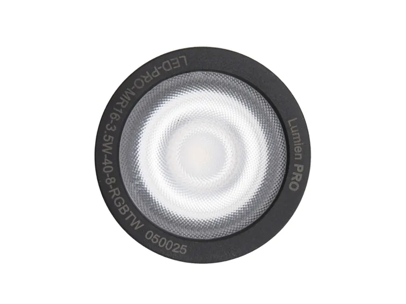 Close-up of a round Lumien PRO LED light with textured lens and black rim on white background