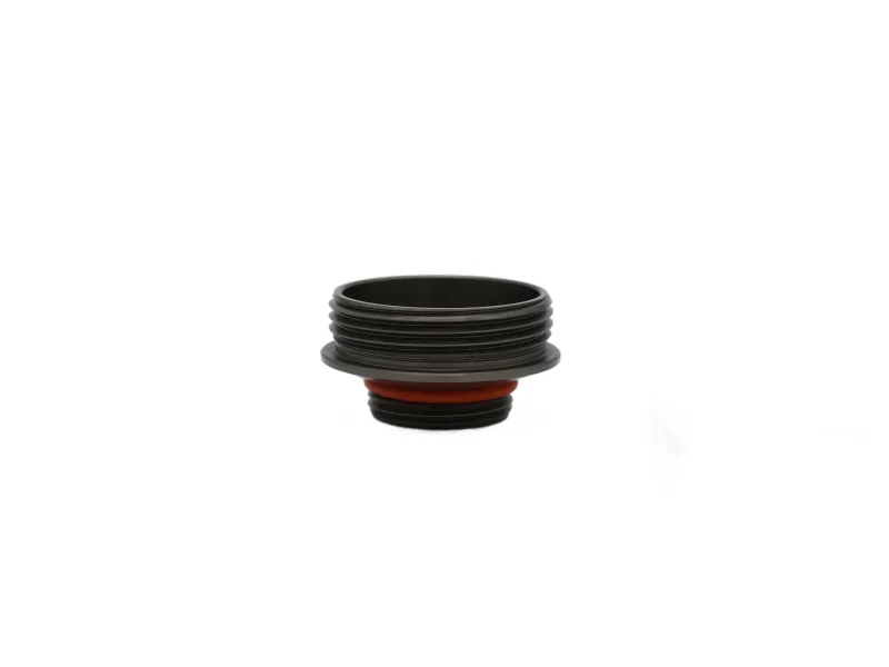 Black threaded cylindrical mechanical part with red gasket ring isolated on white background.