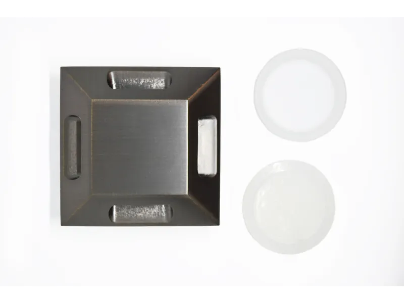 a black rectangular object with a white circle in the middle