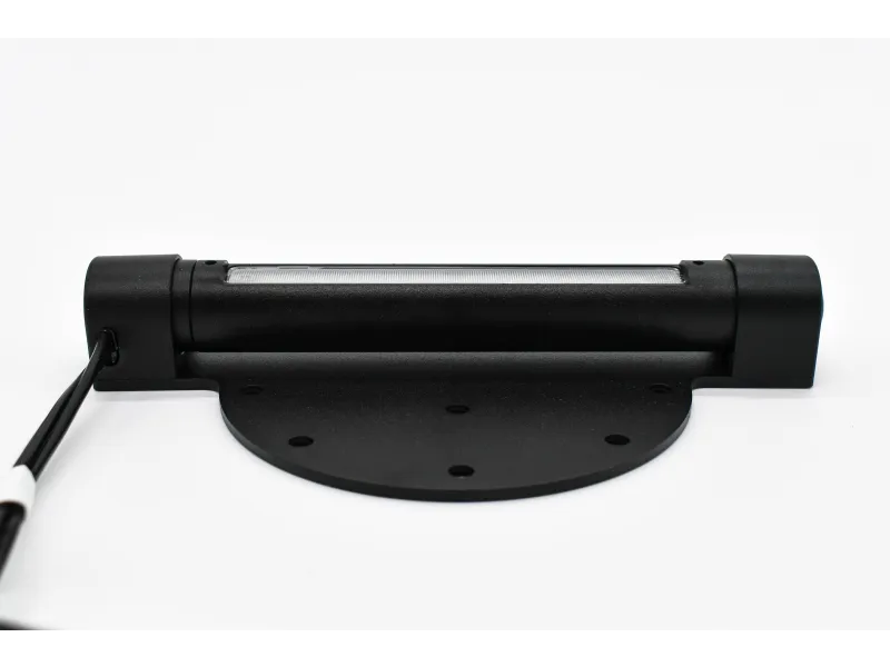 a black stapler on a white surface