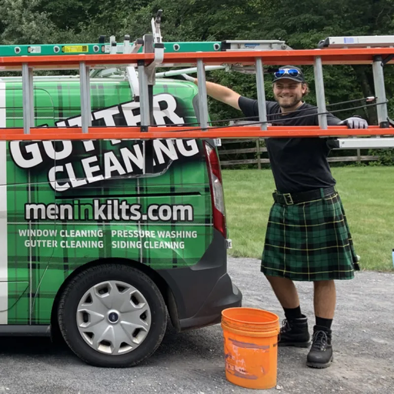 a person standing next to a truck