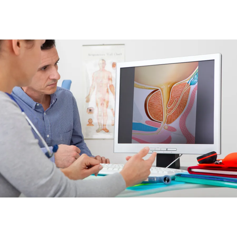 a doctor looking at a computer screen