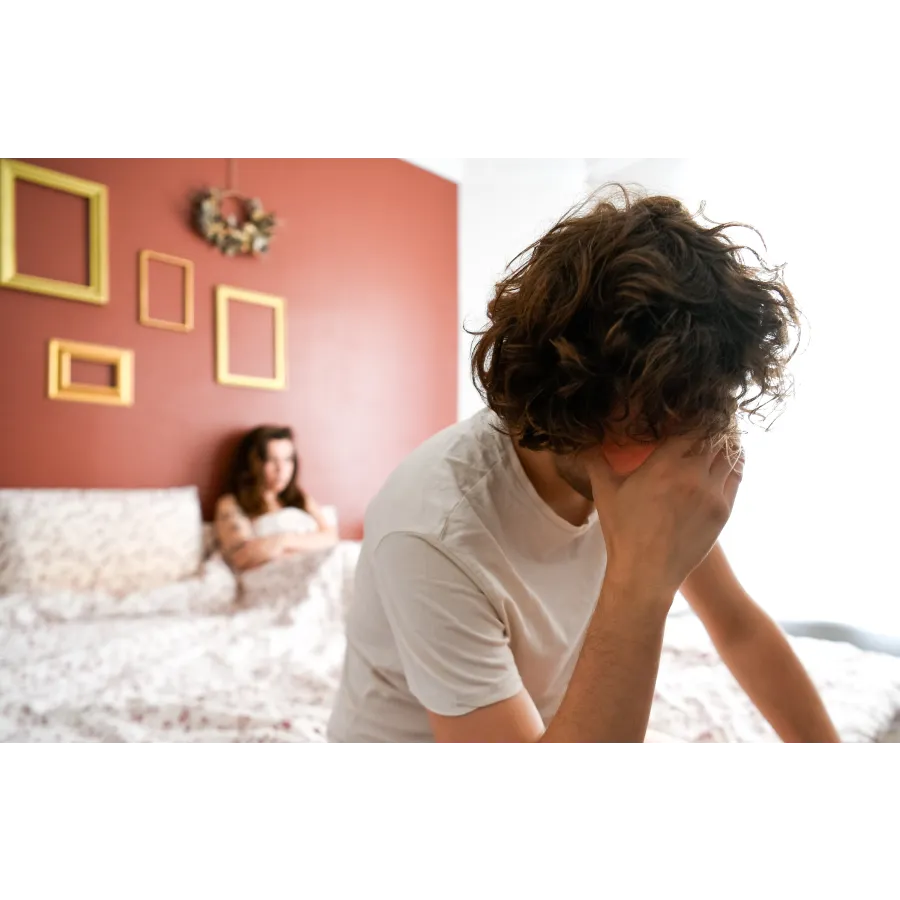 a man sitting on a bed