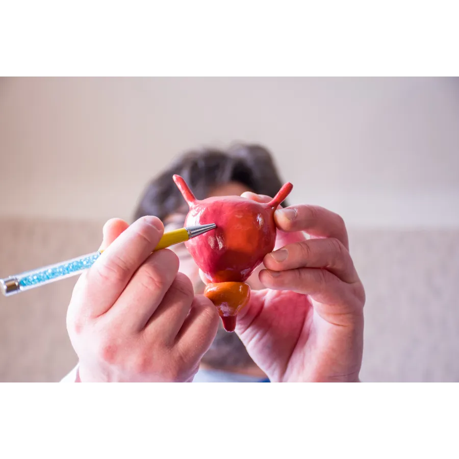 a person painting a red apple