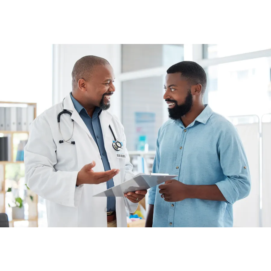 a doctor showing a patient something on the paper