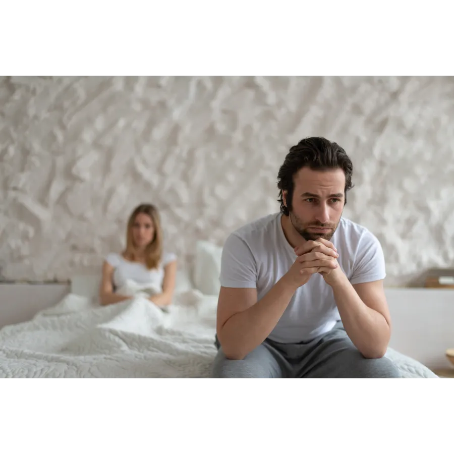 a man sitting on a bed