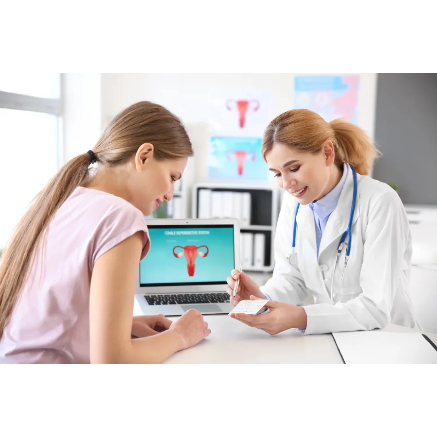 a doctor showing a patient something on the laptop