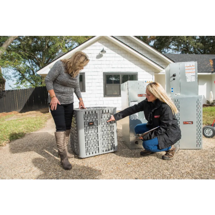 a woman and a man with a large metal box