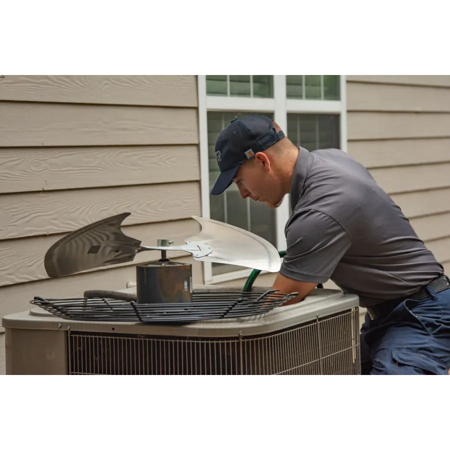 a man cooking food on a grill