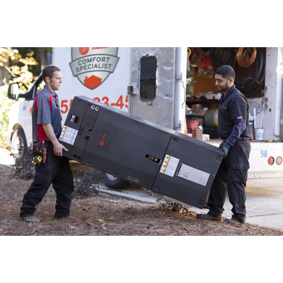 a couple of men standing next to a truck with a box on the back