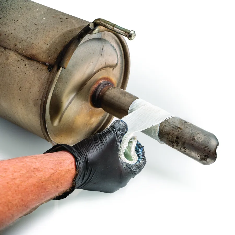 a gloved hand holding a knife