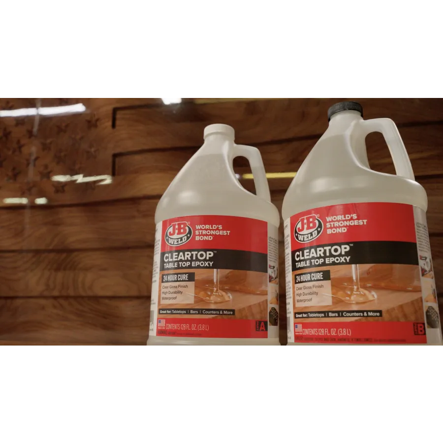 a bottle of liquid next to a box of cigarettes