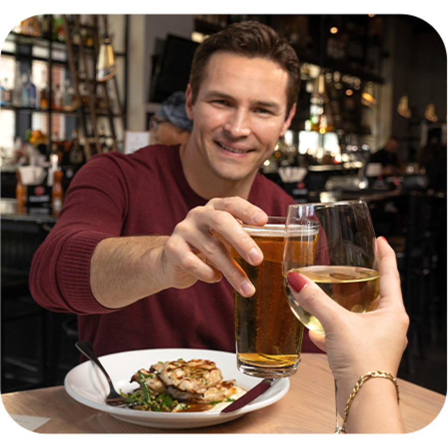 Rocky Myers holding a glass of beer