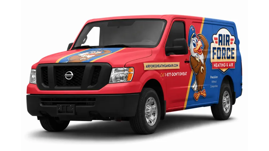 Red and blue Nissan van with Air Force Heating & Air branding and cartoon eagle mascot on the side and hood.