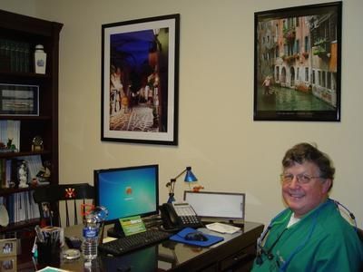 Dr. Alford smiling in his office
