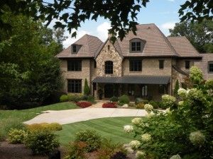 flowers in front of a large house