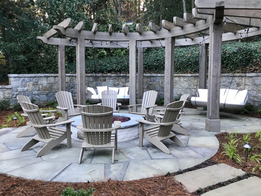 patio furniture around a fire pit