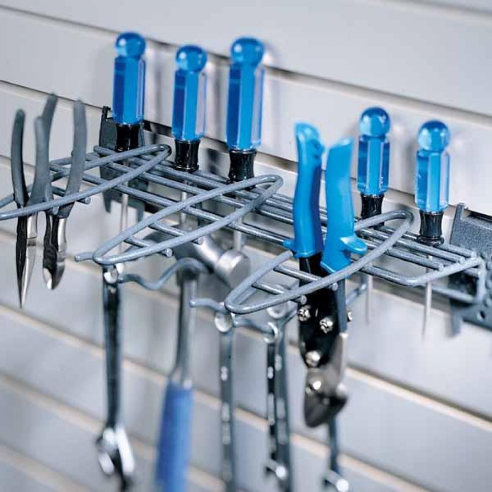 A close up of some tools stored in a garage storage system tool rack 