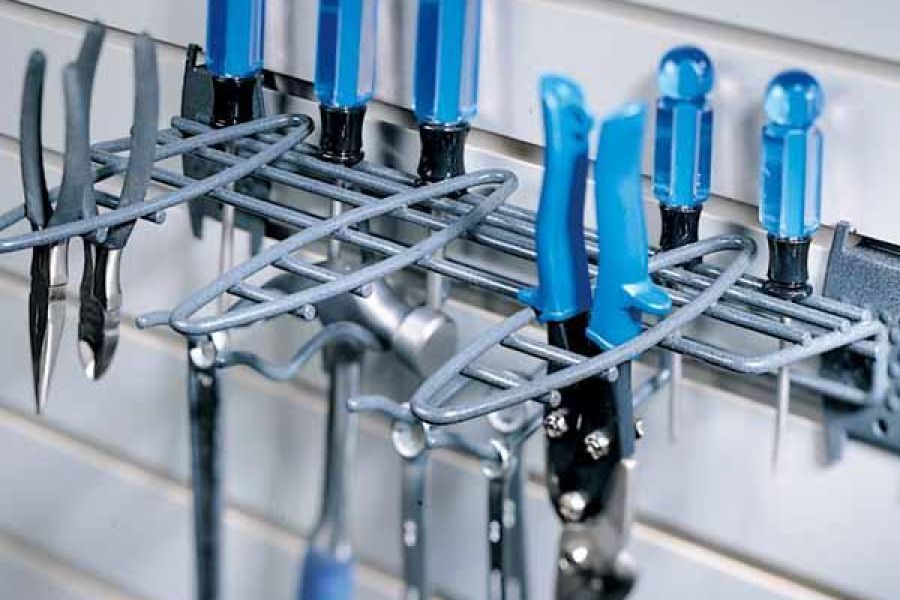Hanging organizers in a garage with blue-handled tools