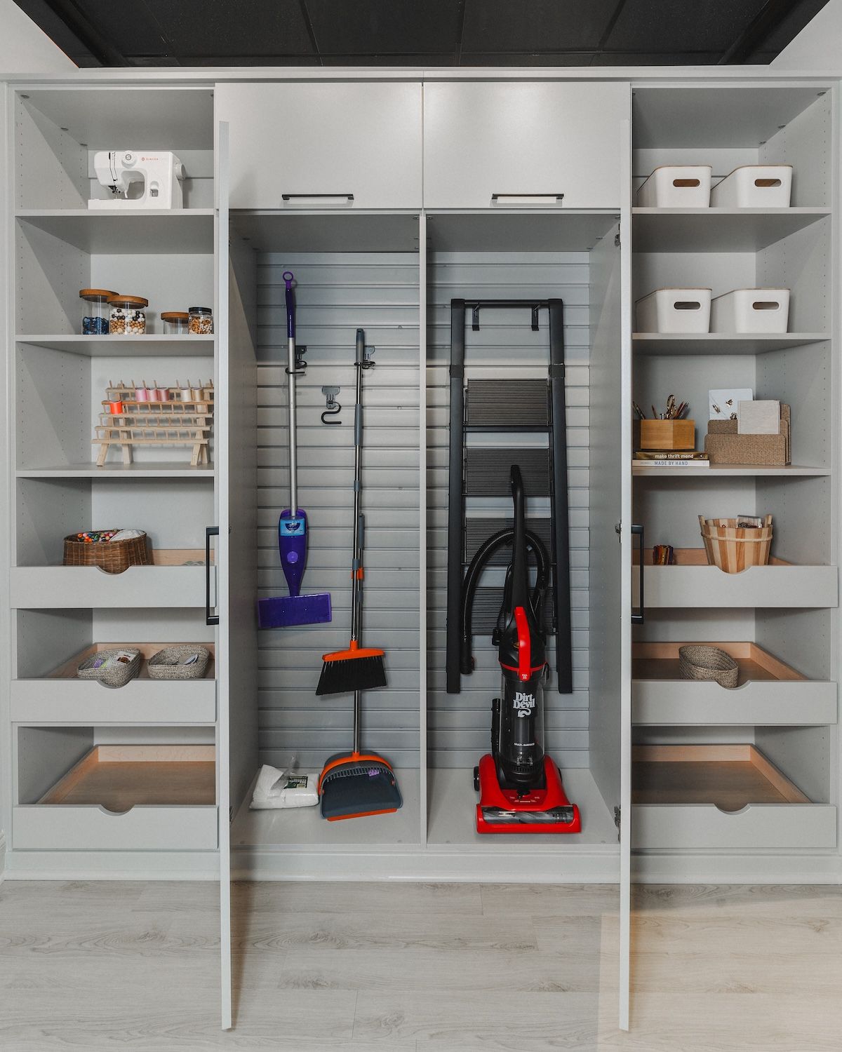 Small closet organization with cleaning supplies