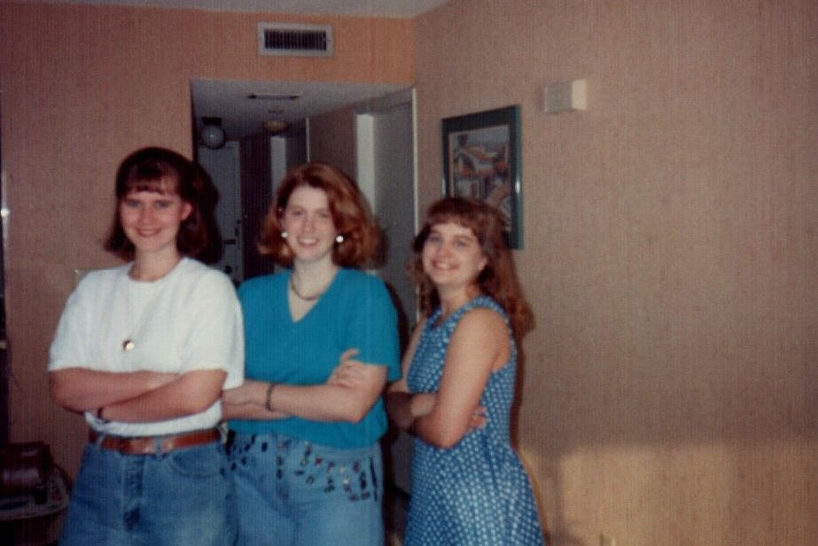 Three Berry students stand in hotel room