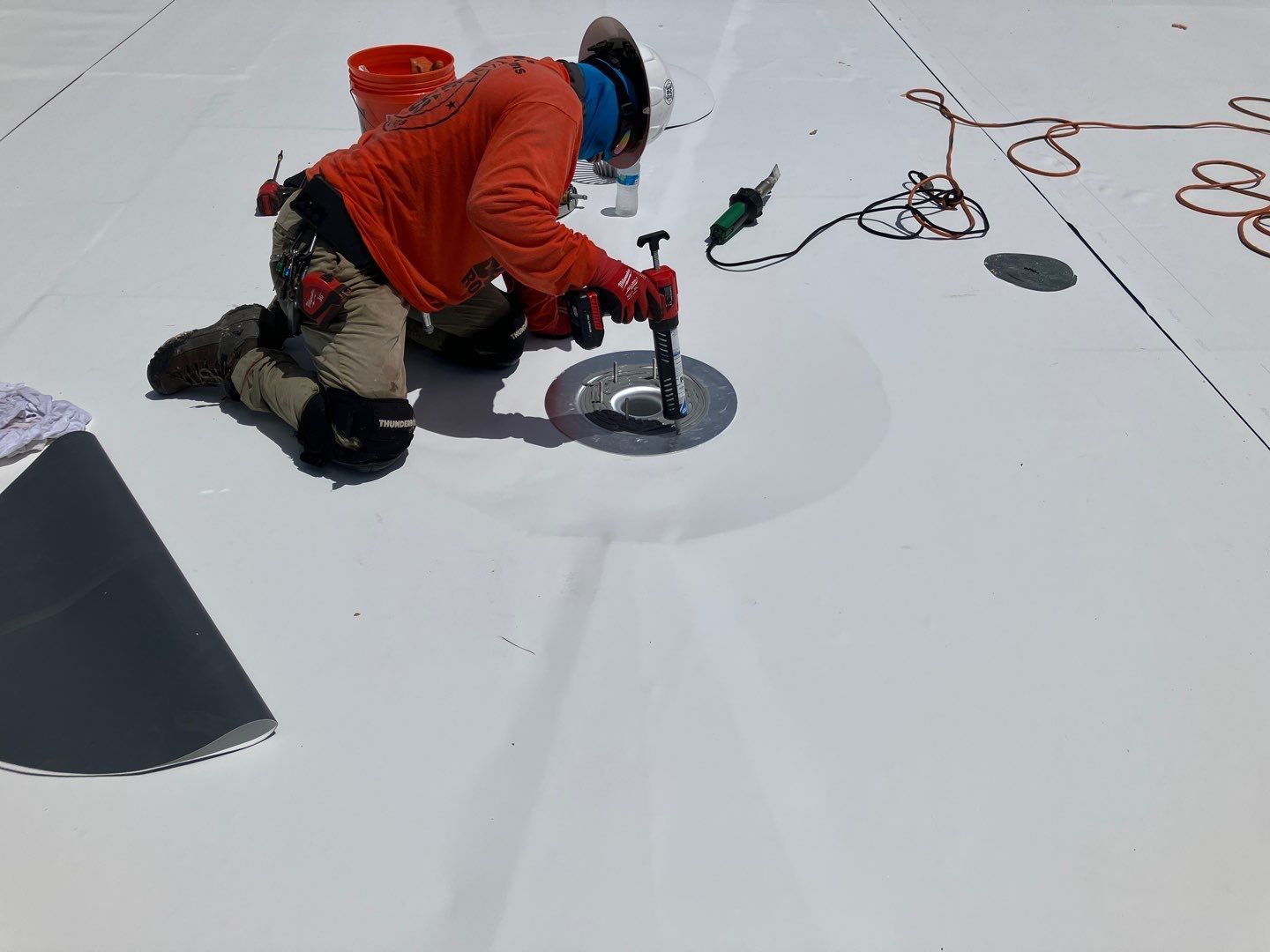 Best roofing installing a flat roof drain