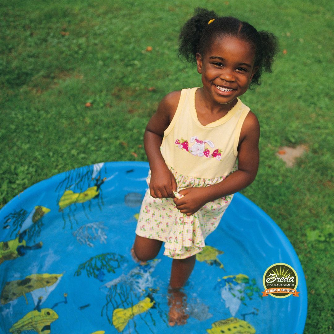 little girl in a kiddie pool in backyard mosquito control metro Atlanta