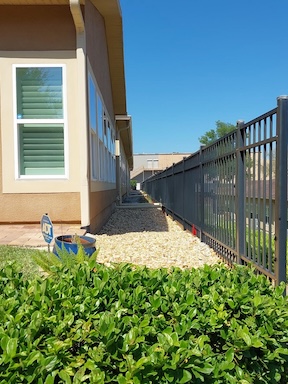 Townhome stabilized on underpinning brackets and helical piles