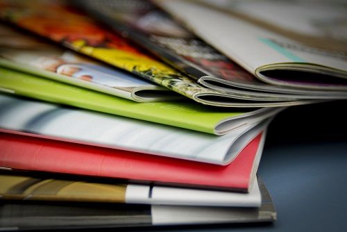 An assortment of Saddle-Stitched books lying on a table