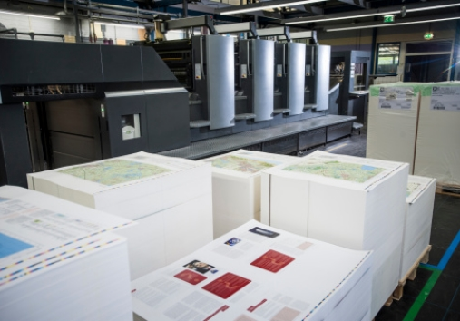 Printed sheets stacked in front of an offset printing pres 