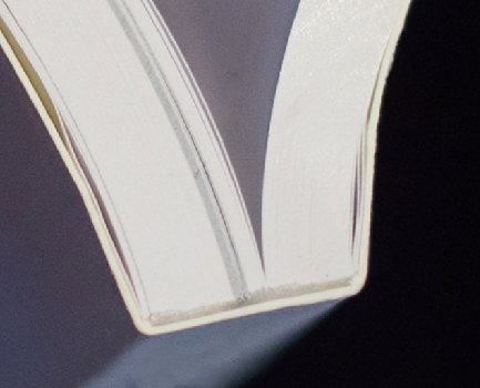 A close up of the spine of a perfect bound book