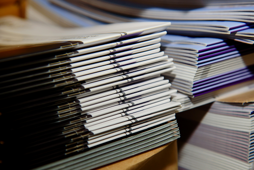 Stacks of Saddle Stitched Booklets