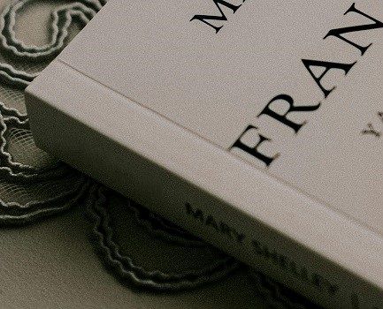 A white perfect bound book with a hinge score on its cover