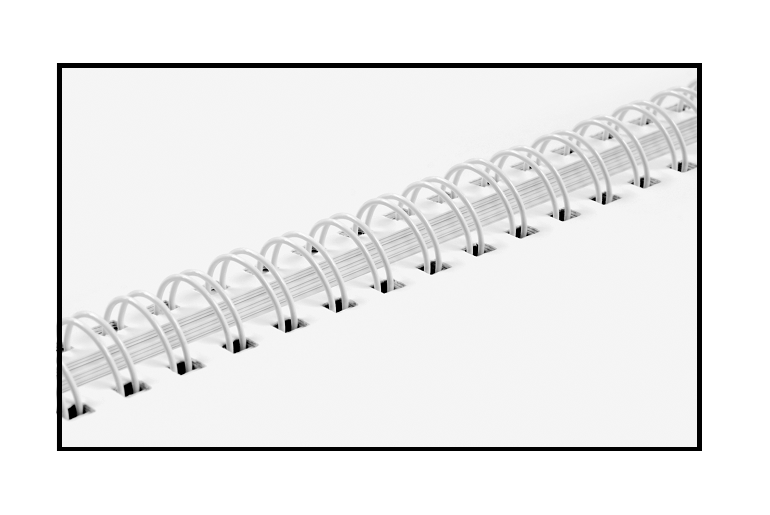 An open Wire-O bound book showing the metal spine loops