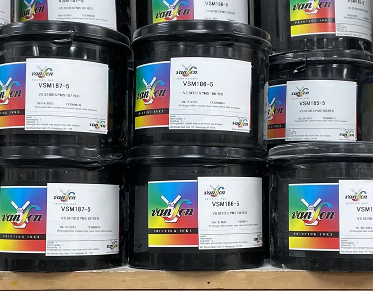 Cans of Premixed Pantone Inks sitting on a shelf