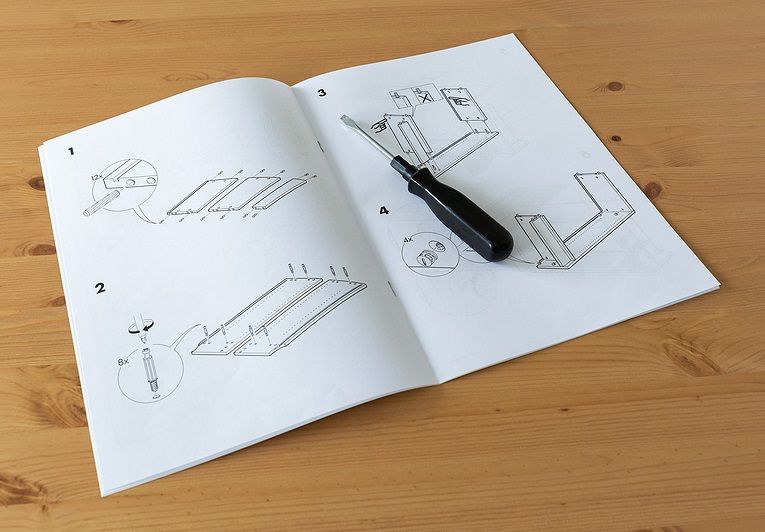 A product assembly manual lying open on a table