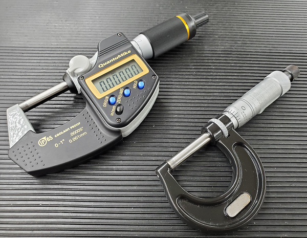 A digital micrometer and a traditional micrometer