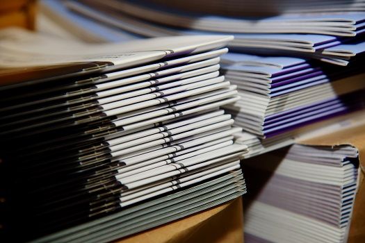 Stacks of Saddle Stitched Books