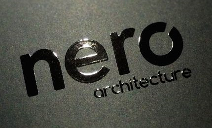 A shiny logo printed on dark gray paper