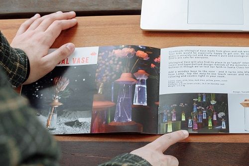 A person looking through a colorful catalog