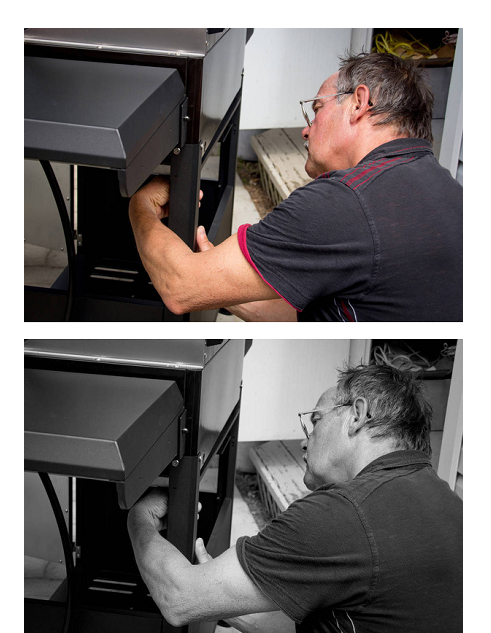 A man assembling an outdoor barbeque grill