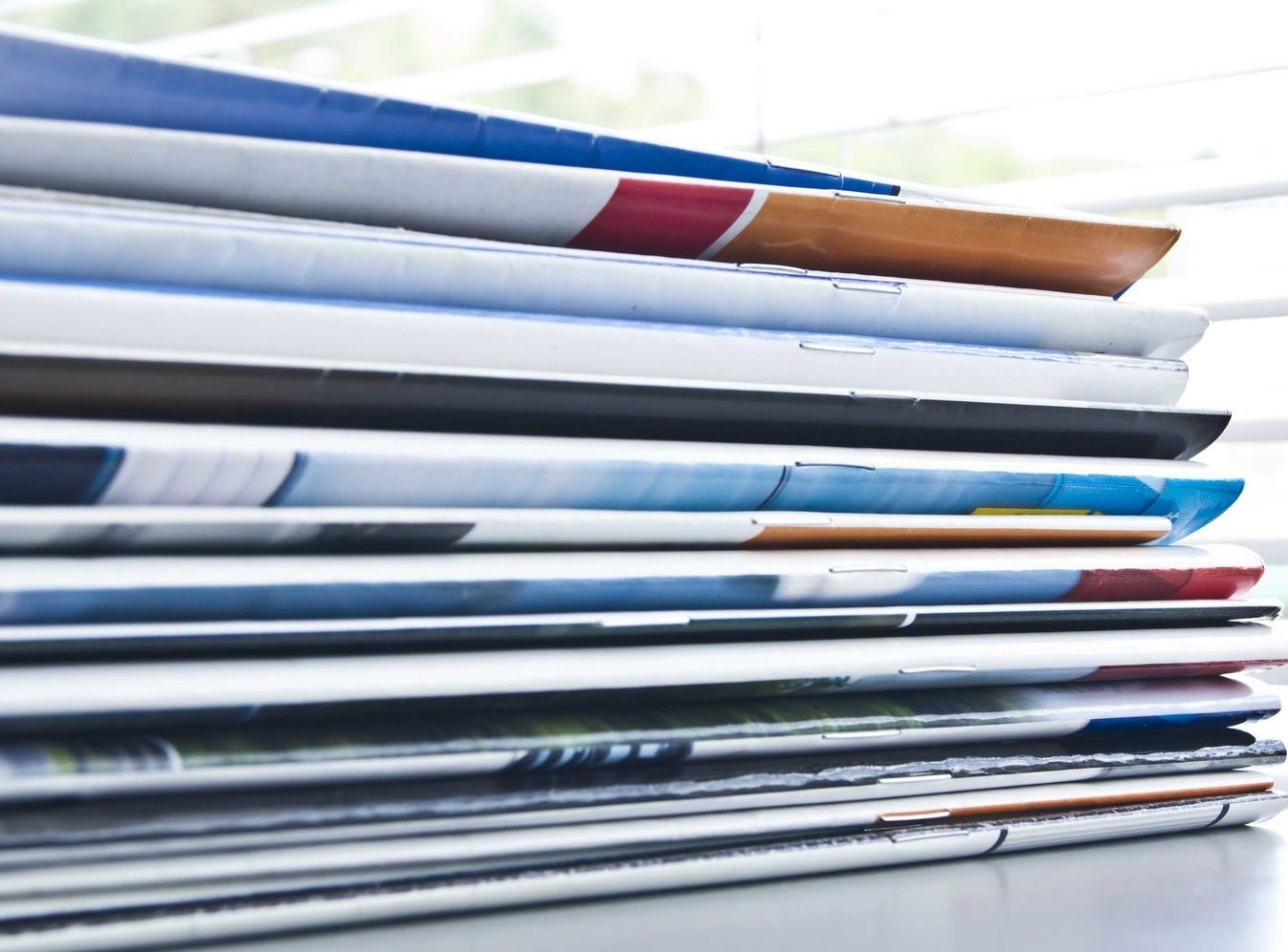 A stack of colorful Saddle Stitched Books