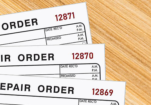 Three repair order forms printed with sequential numbers using red ink 