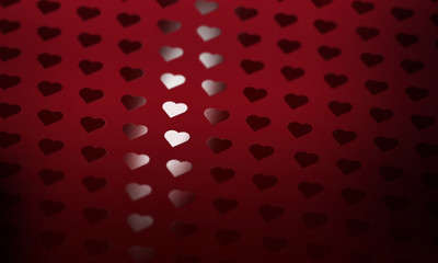 A matte burgundy paper stock with Spot UV hearts applies