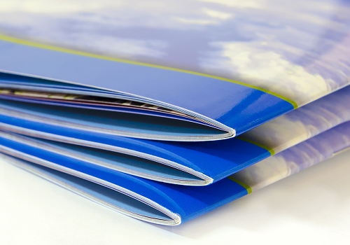 A stack of booklets with UV Coated covers