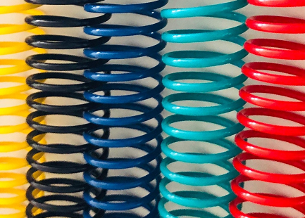 An assortment of colorful binding coils