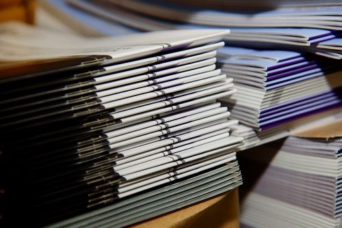 Stacks of Saddle Stitched Booklets