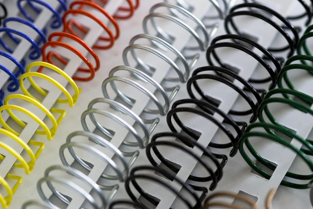 An assortment of colored Wire-O binding spines 