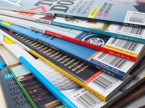 A stack of colorfully printed magazines