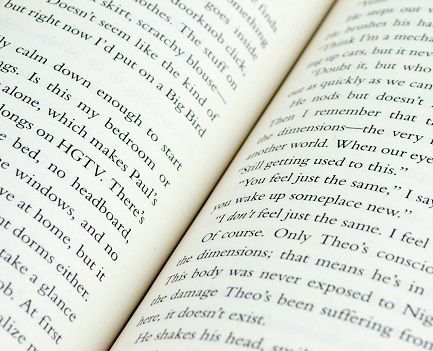An open book with black text on white pages